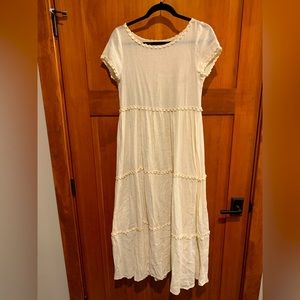 Light weight cotton summer dress with sleeves and lace trim.